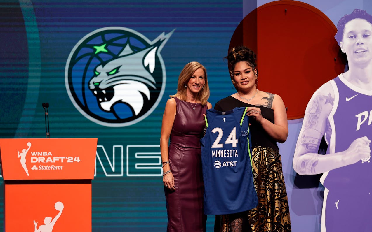 Utah's Alissa Pili, right, poses for a photo with WNBA commissioner Cathy Engelbert after being selected eighth overall by the Lynx in the 2024 WNBA d