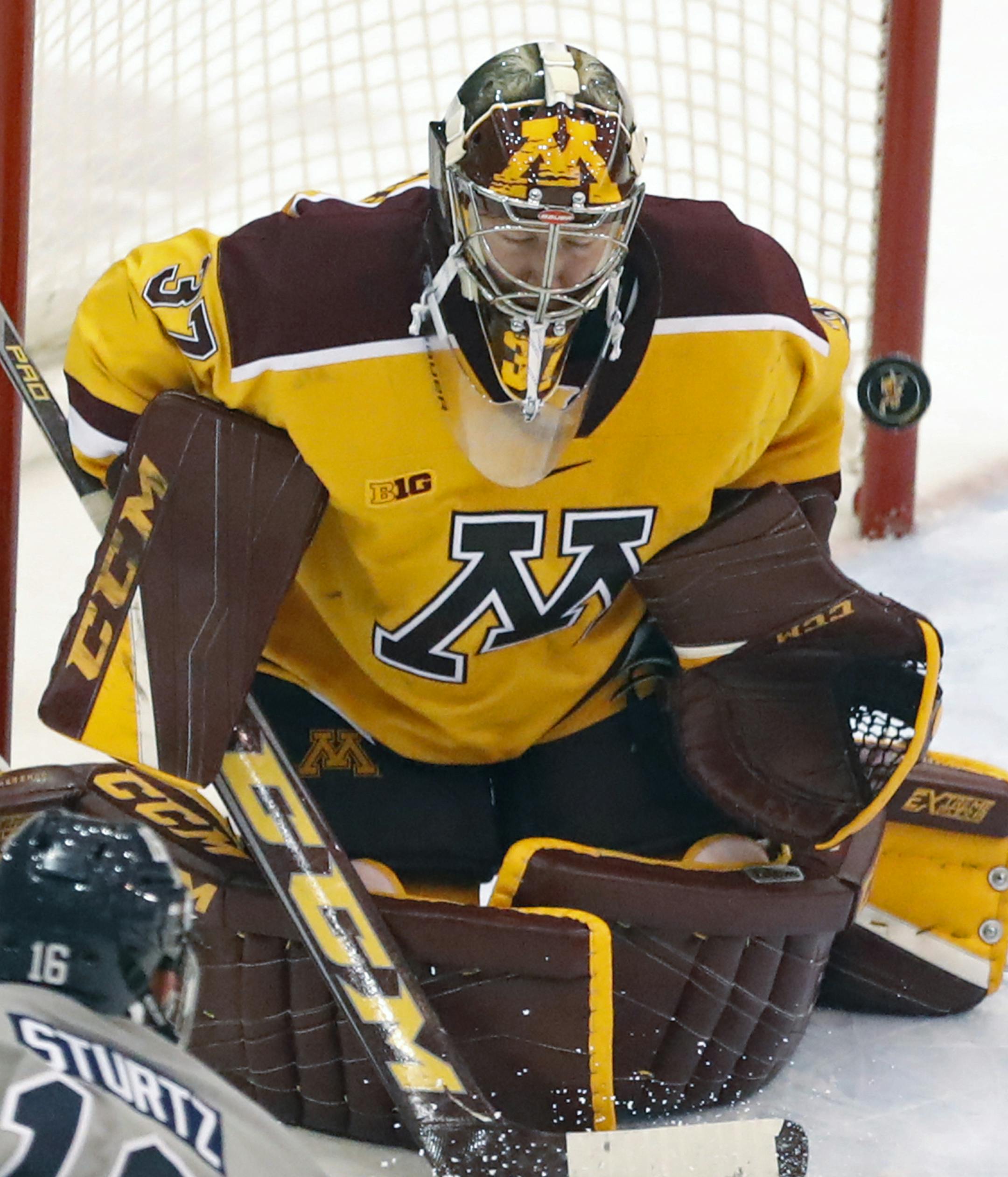 Gophers goalie Eric Schierhorn(37) makes a save.] Sunday afternoon Gophers hockey game, vs. Penn State. at Mariucci 3M Arena.Richard Tsong-Taatarii/Richard.tsong-taatarii@startribune.com
