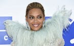 FILE - In this Aug. 28, 2016 file photo, Beyonce Knowles arrives at the MTV Video Music Awards at Madison Square Garden, in New York. Beyonce announce