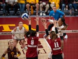 The Gophers' Taylor Landfair (12) with a spike late in the third game Sunday night, September 25, 2022 at the Maturi Pavilion in Minneapolis. The University of Minnesota women's volleyball team defeated the University of Wisconsin in three straight games. ] JEFF WHEELER • Jeff.Wheeler@startribune.com