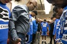 North High coach Larry McKenzie lead his team in prayers before a game against Southwest at North High School Tuesday February 12, 2019 in Minneapolis