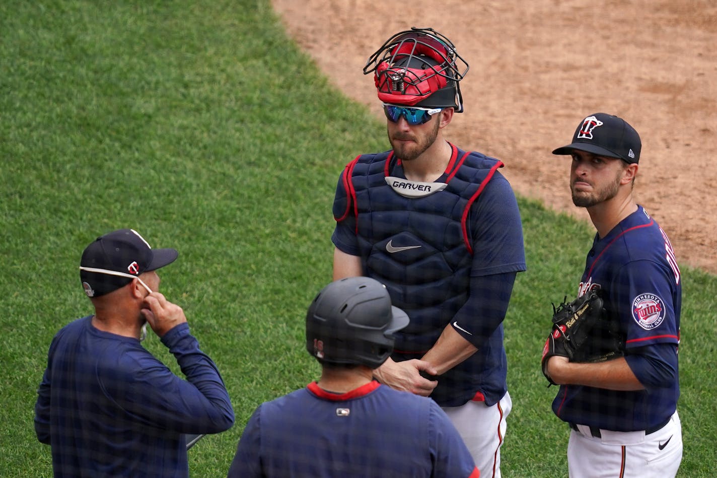 Minnesota Twins catcher Mitch Garver (8) and pitcher Jake Odorizzi (12) talked with pitching coach Wes Johnson (47) during live batting practice Saturday. ] ANTHONY SOUFFLE • anthony.souffle@startribune.com The Minnesota Twins held practice as part of their Summer Camp Saturday, July 4, 2020 at Target Field in Minneapolis.