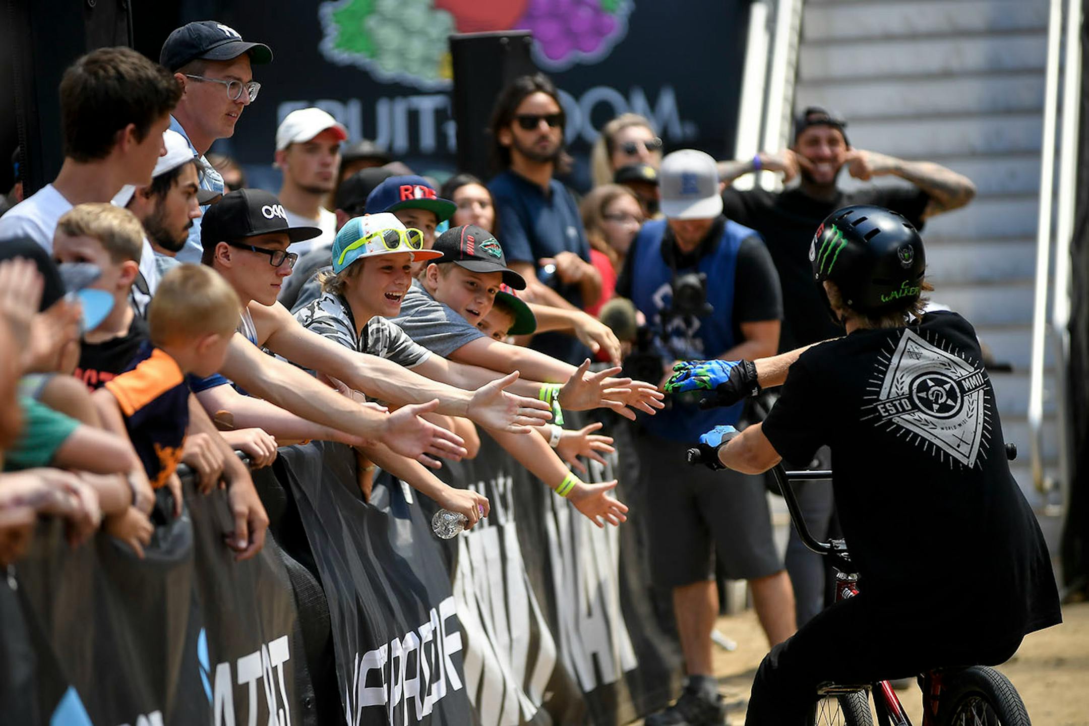 Colton Walker high fived fans after his third and final jump in the BMX dirt finals Sunday. He won gold in the event.