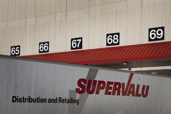 The Supervalu Inc. logo is displayed on a truck at a distribution center in Hopkins.