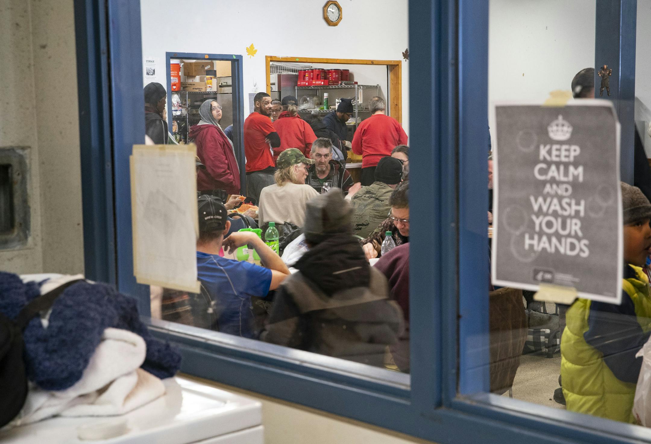 People line up for free lunch at CHUM Food Shelf in Duluth, MN on Tuesday March 17, 2020. With limited space and surging demand, it is nearly impossible to enforce social distancing and thus puts Duluth's vulnerable populations at greater risk of contracting COVID-19. ]
ALEX KORMANN • alex.kormann@startribune.com CHUM in Duluth, MN is feeling the effects of COVID-19 with overcrowded spaces and no room to practice social distancing. They hope to be able to gain access to a larger temporary