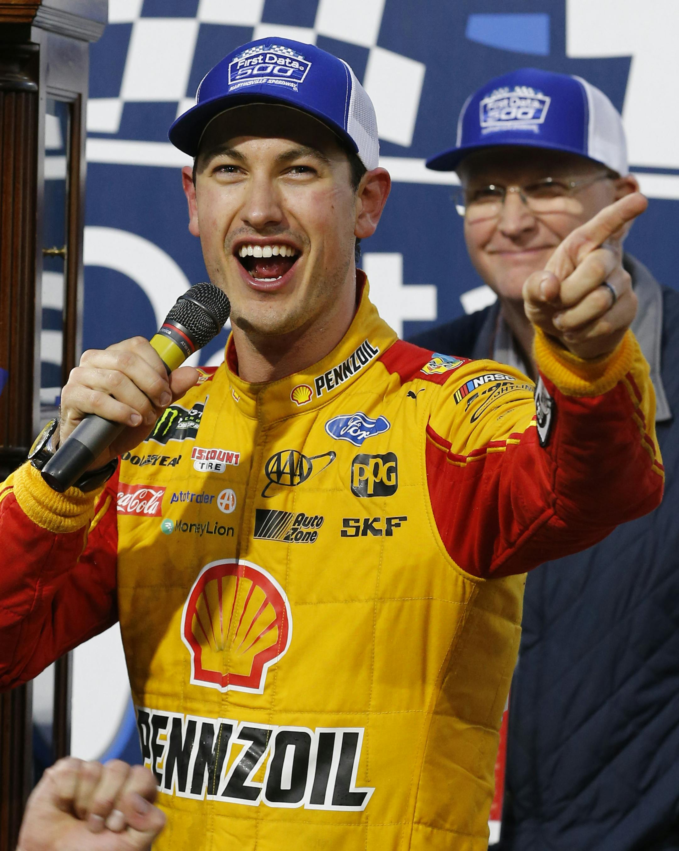 Joey Logano celebrates after winning the Monster Energy NASCAR Cup Series auto race at Martinsville Speedway in Martinsville, Va., Sunday, Oct. 28, 2018. (AP Photo/Steve Helber)
