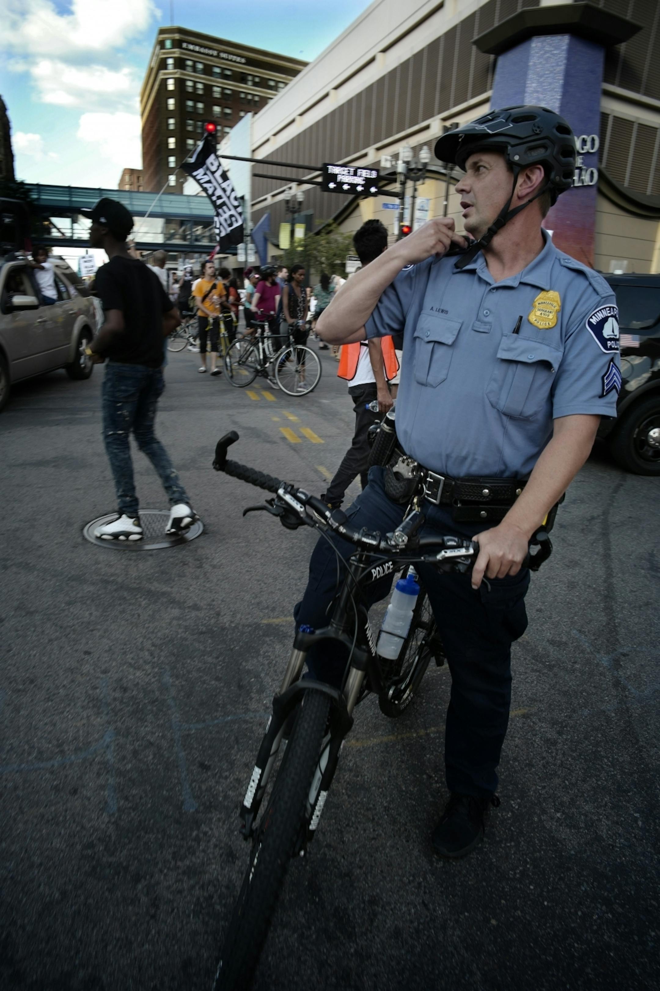 Minneapolis police tried to keep traffic clear as protesters moved towards Target Field.