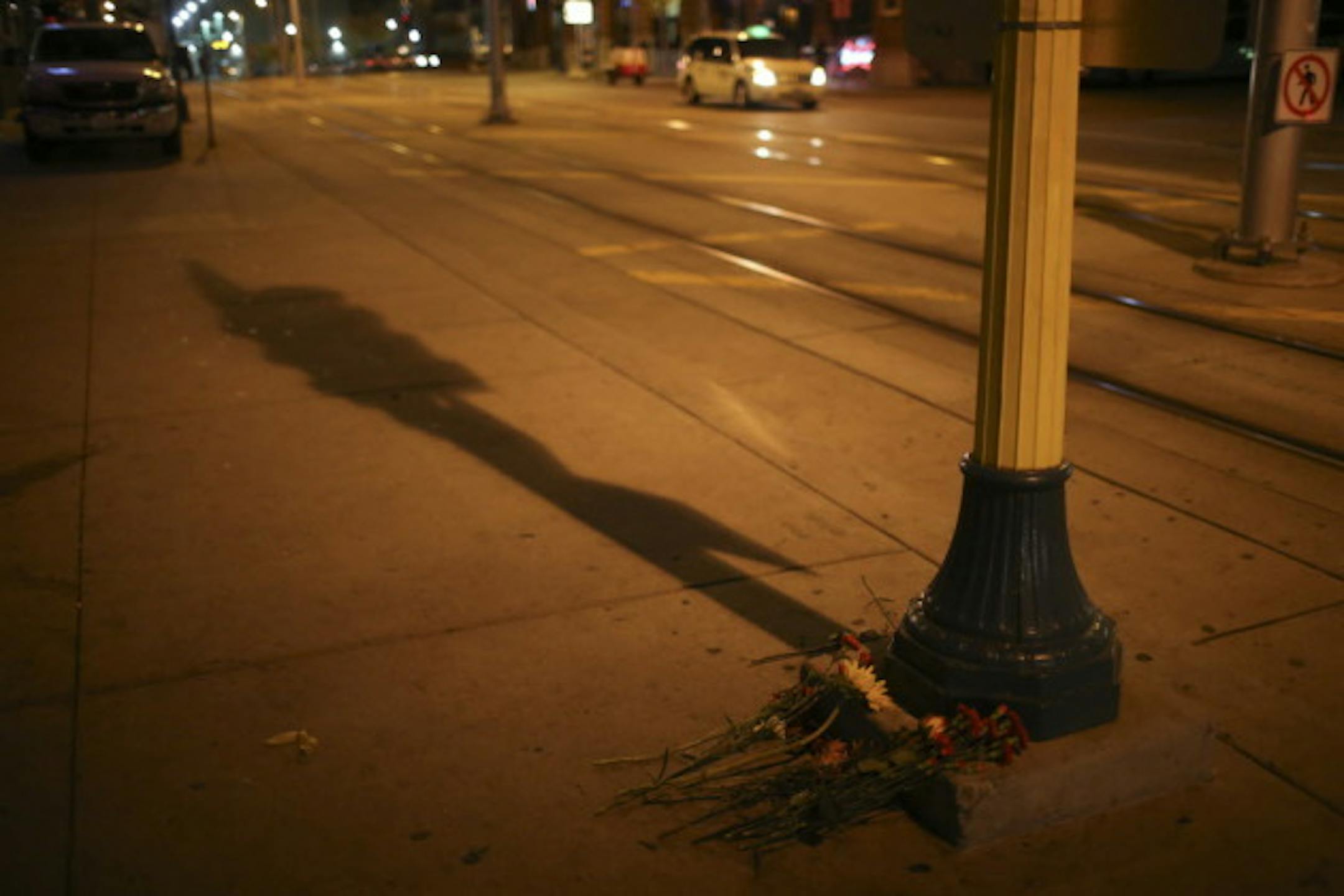 Flowers placed outside Epic, the club on 5th St. N. where patron Tyrone Washington, 27, of Crystal, was shot and killed Nov. 3. The case remains under investigation. Photo by Jeff Wheeler, Star Tribune.