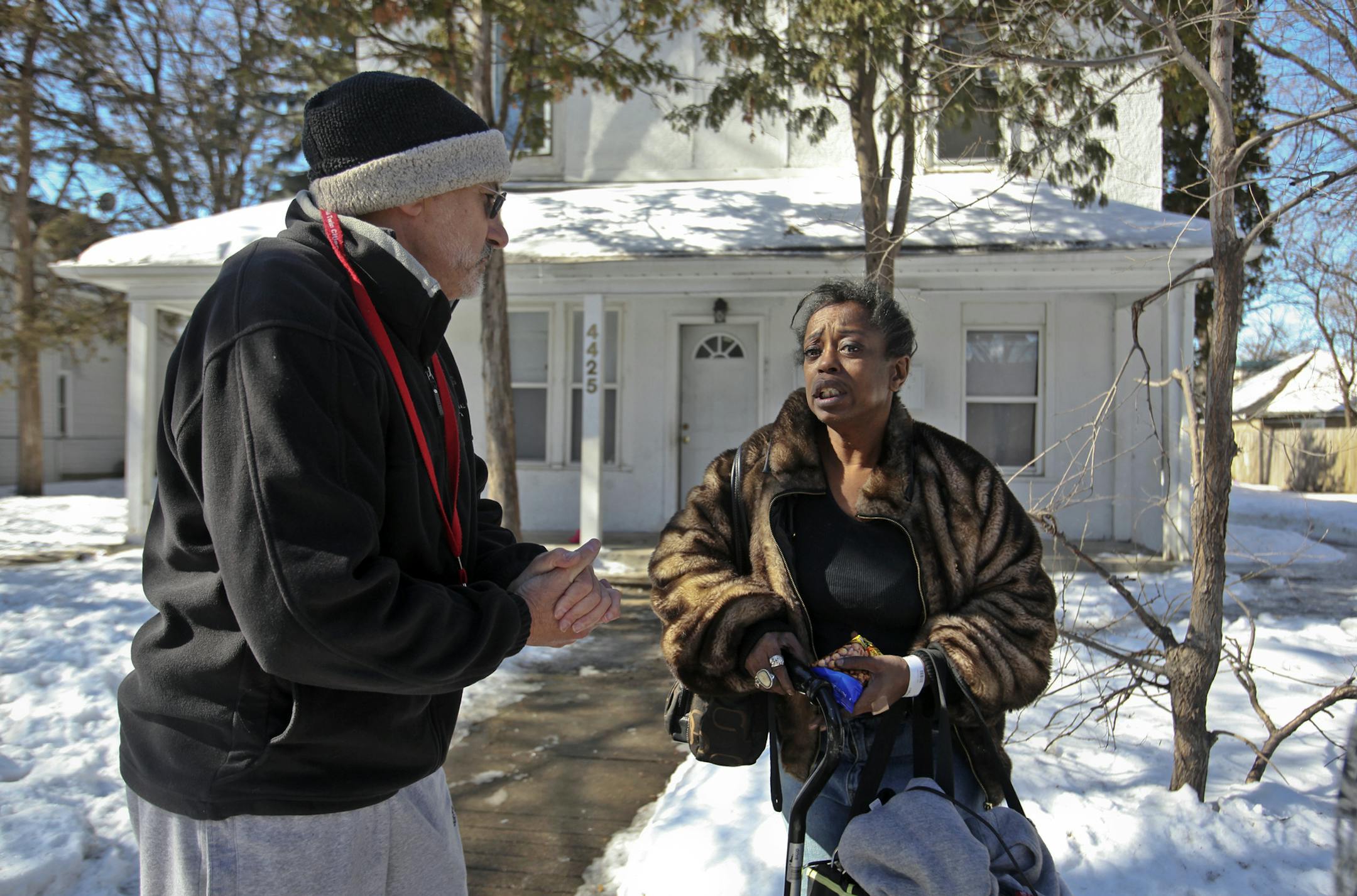 Red Cross volunteer Ed Newman, left, checks in on Angela Cannedy who was among those displaced by an early morning fire at a 4425 Aldrich Ave. N. apartment building that left nine injured Saturday, March 2, 2013, in Minneapolis, MN. Cannedy was leaving her charred residence with a few of her belongings in an awaiting taxi cab.] (DAVID JOLES/STARTRIBUNE) Followup on early morning northside apartment fire where several residents fled by jumping from windows and nine were injured.**Ed Newman, Angel