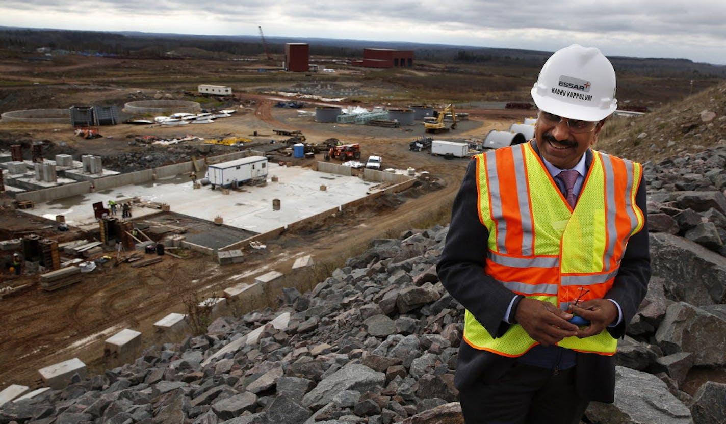 Madhu Vuppuluri, president and CEO of Essar Steel Minnesota, looks over the Essar Project in Nashwauk, Minn. Essar Steel Minnesota recently ramped up construction on an $1.8 billion taconite plant after securing the funding needed to complete the project. ] LEILA NAVIDI leila.navidi@startribune.com / BACKGROUND INFORMATION: Thursday, October 30, 2014. The plant endured several delays over the past two years as funds periodically ran dry and some contractors were paid late and walked off the job.