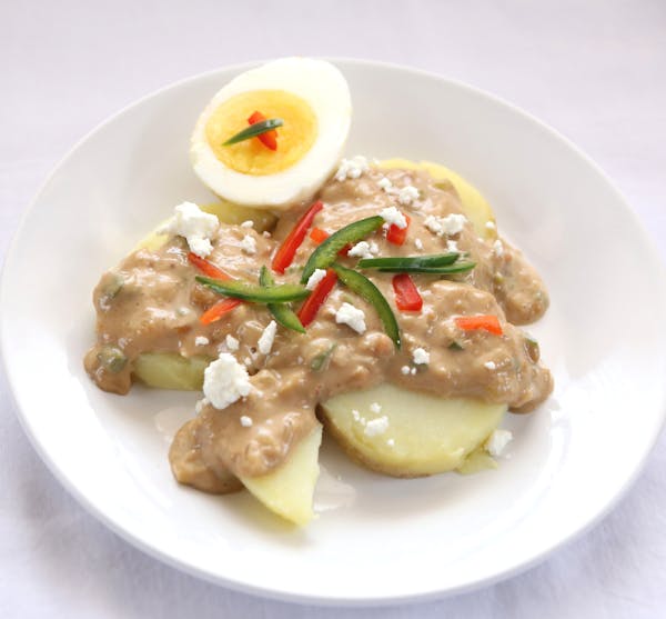 Peruvian potatoes in peanut sauce. Photo by Robin Asbell