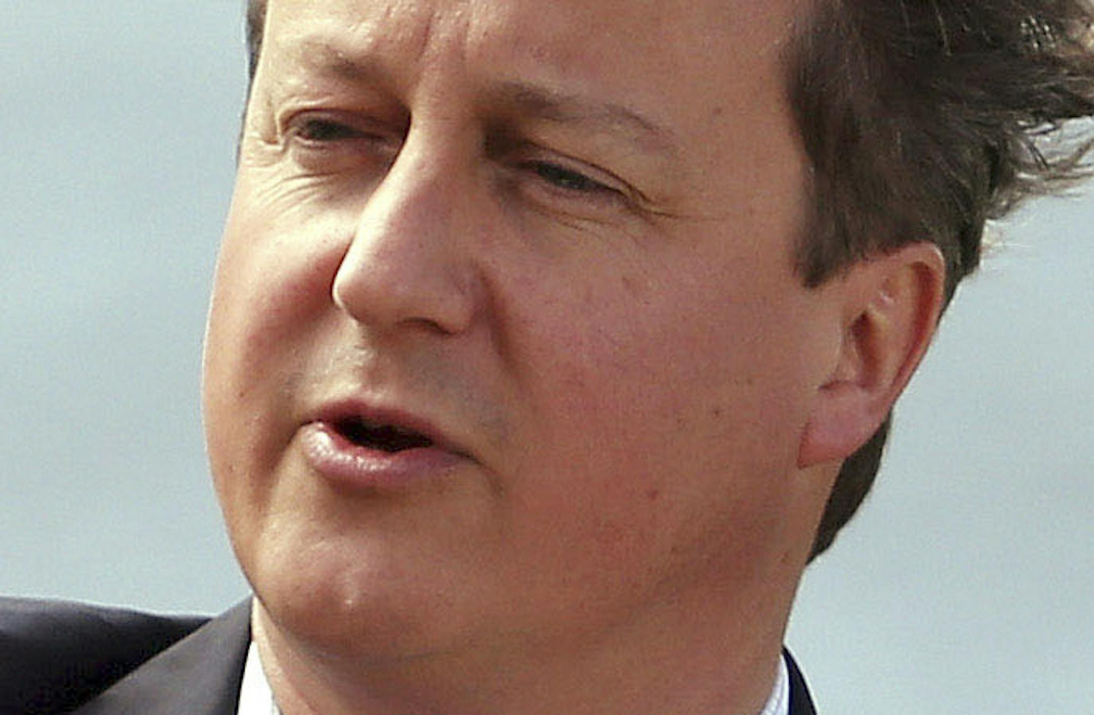 British Prime Minister David Cameron speaks during a media conference at the G-8 summit at the Lough Erne golf resort in Enniskillen, Northern Ireland, on Tuesday, June 18, 2013. The final day of the G-8 summit of wealthy nations is ending with discussions on globe-trotting corporate tax dodgers, a lunch with leaders from Africa, and suspense over whether Russia and Western leaders can avoid diplomatic fireworks over their deadlock on Syriaís civil war. (AP Photo/Matt Cardy, Pool)