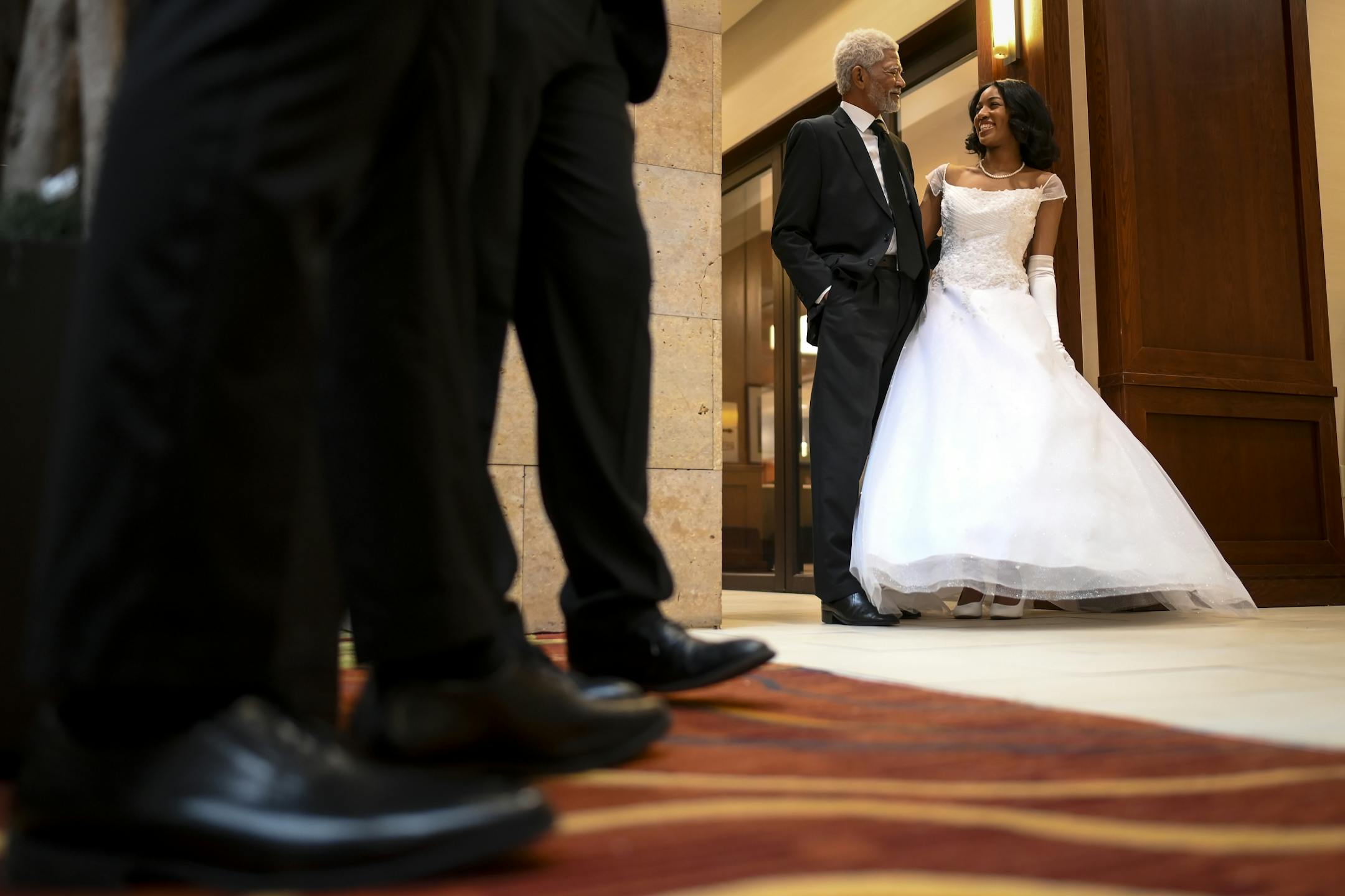 Richard J. Harris, visiting from San Bernardino, Calif., posed for a photo with his granddaughter, Breah Banks, a junior at Benilde St. Margaret's, a few hours before the start of Saturday's cotillion.