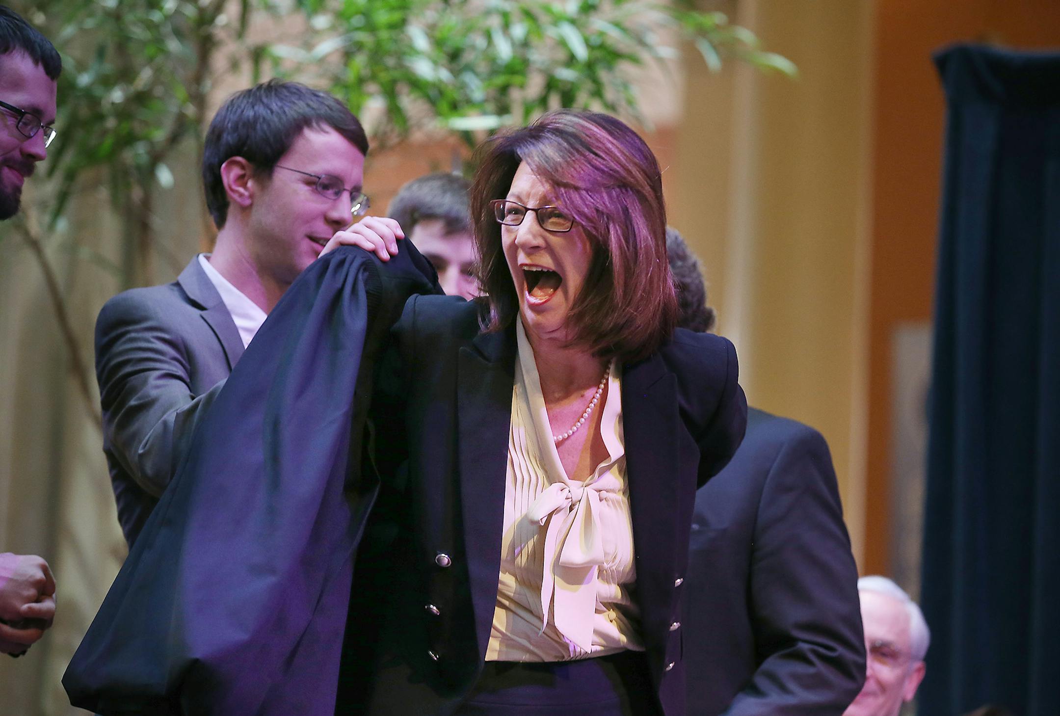 The Honorable Lucinda E. Jesson reacted with excitement as her family helped her with her robe during the swearing-in ceremony as Minnesota Court of Appeals judges at the Landmark Center, Wednesday, February 10, 2016 in St. Paul, MN. ] (ELIZABETH FLORES/STAR TRIBUNE) ELIZABETH FLORES • eflores@startribune.com