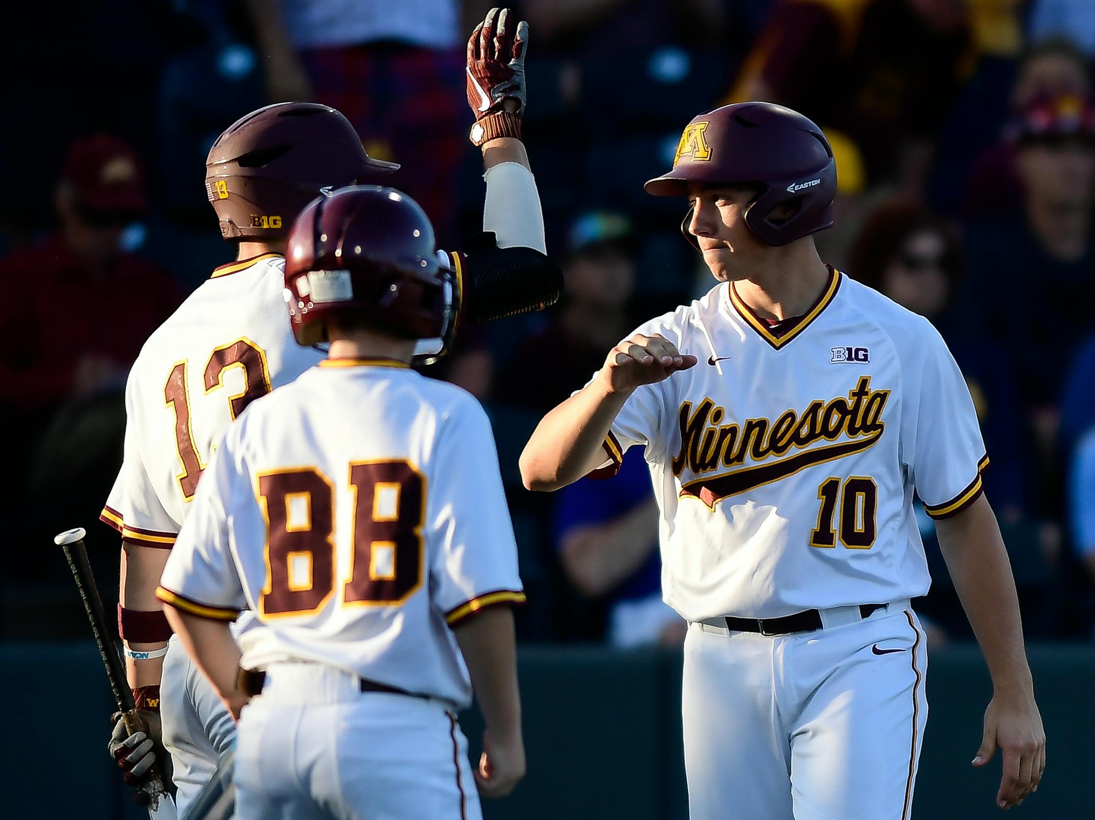 Minnesota catcher Cole McDevitt (10) high fived infielder Luke Pettersen (13) after McDevitt scored a run in the bottom of the third inning against Canisius. ] AARON LAVINSKY ï aaron.lavinsky@startribune.com The University of Minnesota Golden Gophers baseball team played the Canisius Golden Griffins in a NCAA tournament game on Friday, June 1, 2018 at Siebert Field in Minneapolis, Minn.