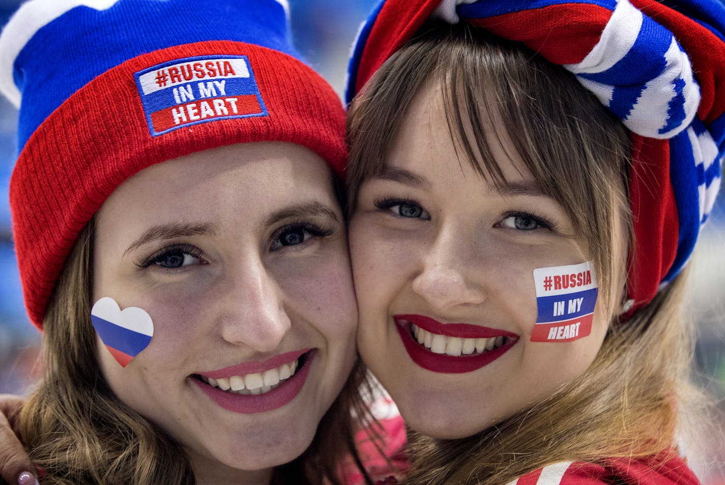 Two Russians enjoyed the OAR hockey game.