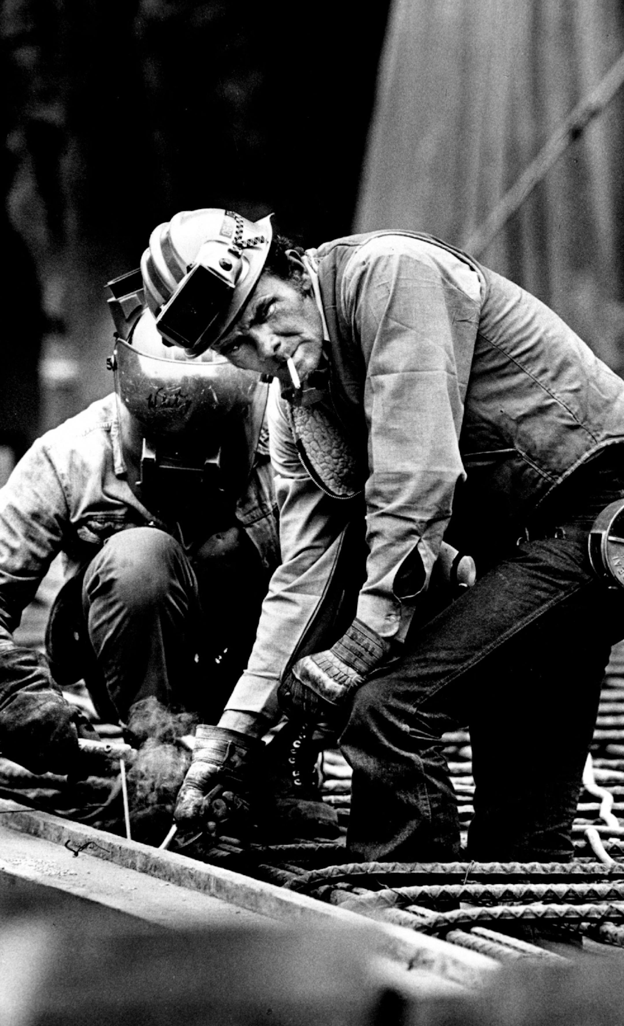 1978: Dick Cassidy looked away as Paul Davis welded a iron rod during construction at existing reserve plant.