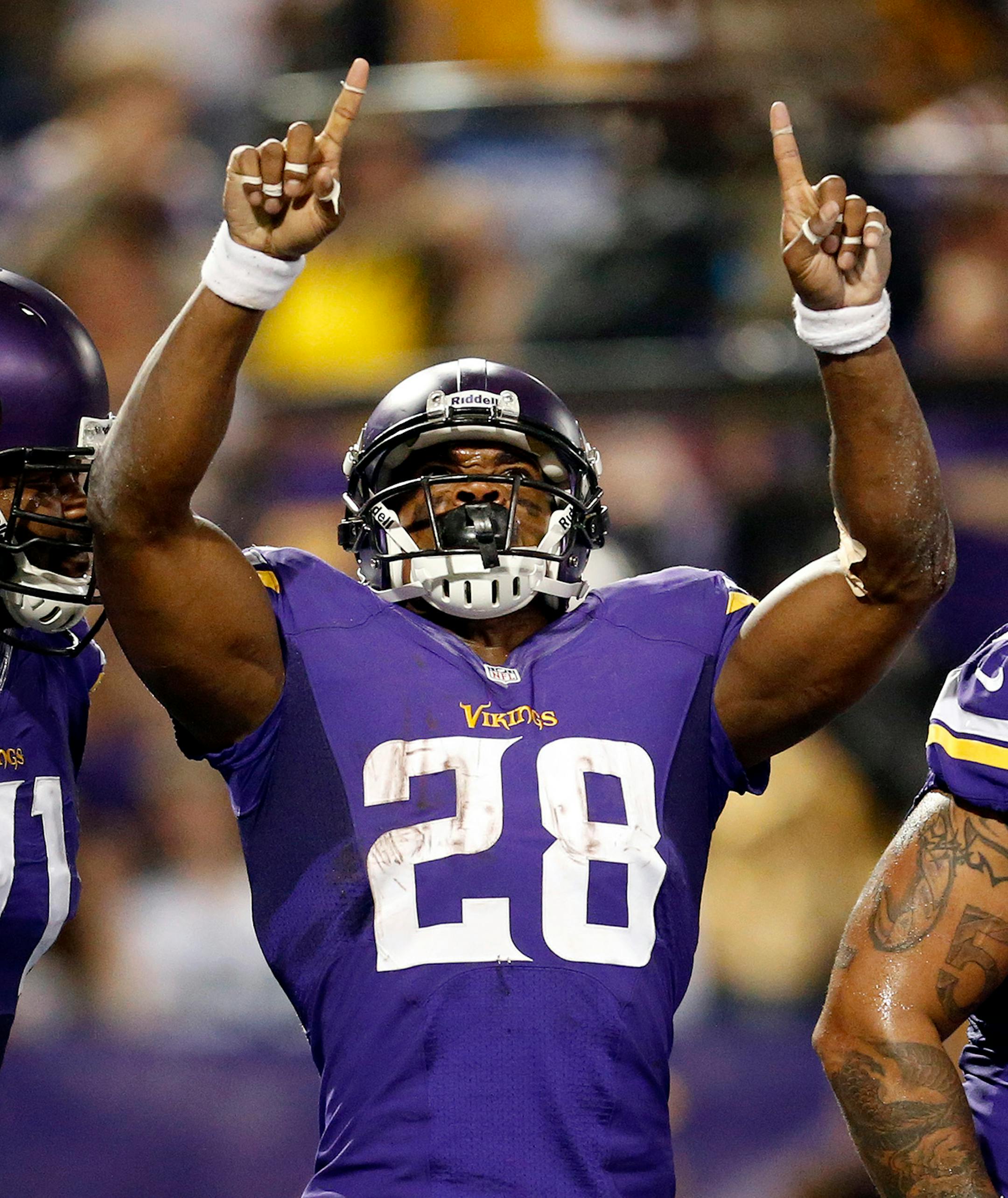 Minnesota Vikings running back Adrian Peterson (28) celebrated after scoring a touchdown in the second quarter. ] CARLOS GONZALEZ cgonzalez@startribune.com October 27, 2013, Minneapolis, Minn., The Metrodome, Mall of America Field, NFL. Minnesota Vikings vs. Green Bay Packers