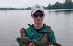Brady Rudh, with a bowfish (his favorite species) during research work for the University of Minnesota.