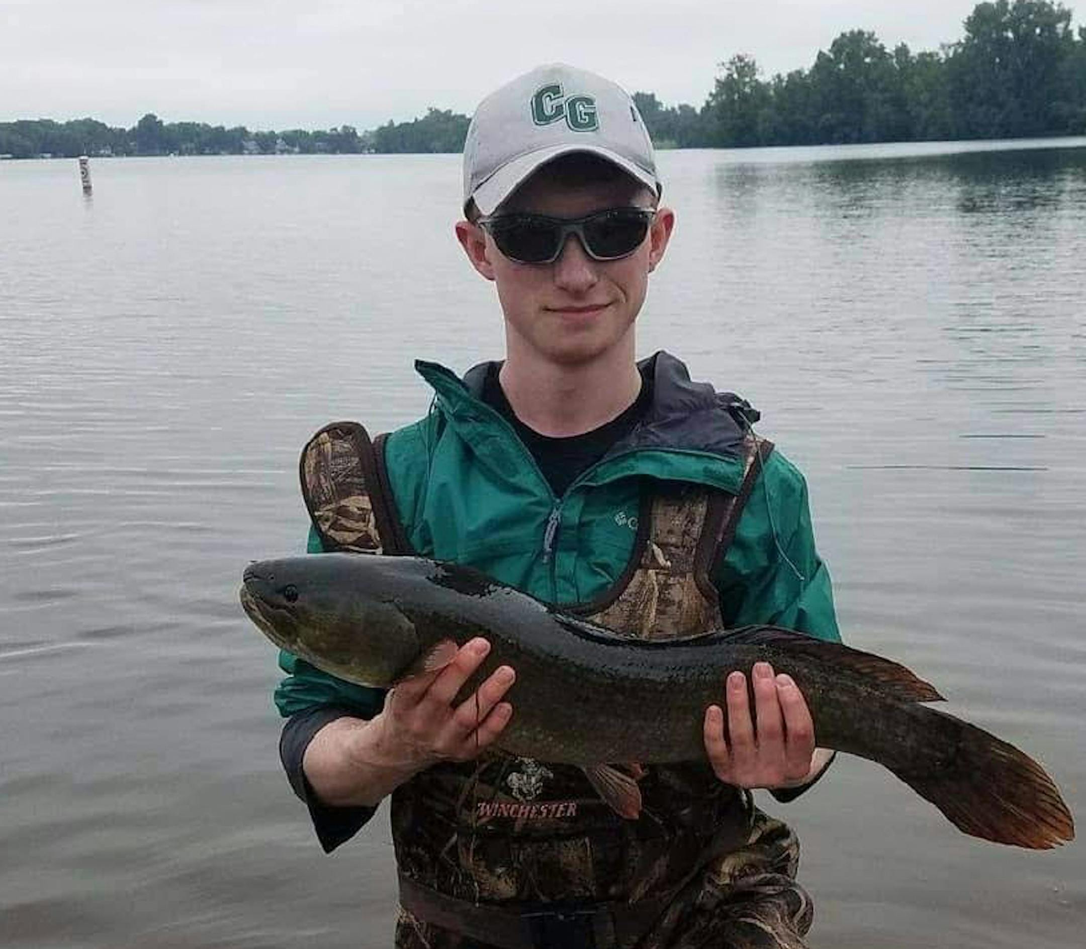 Brady Rudh, with a bowfish (his favorite species) during research work for the University of Minnesota.