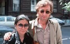 In this Aug. 22, 1980, file photo, John Lennon and his wife Yoko Ono arrive at the Hit Factory, a recording studio in New York City.
