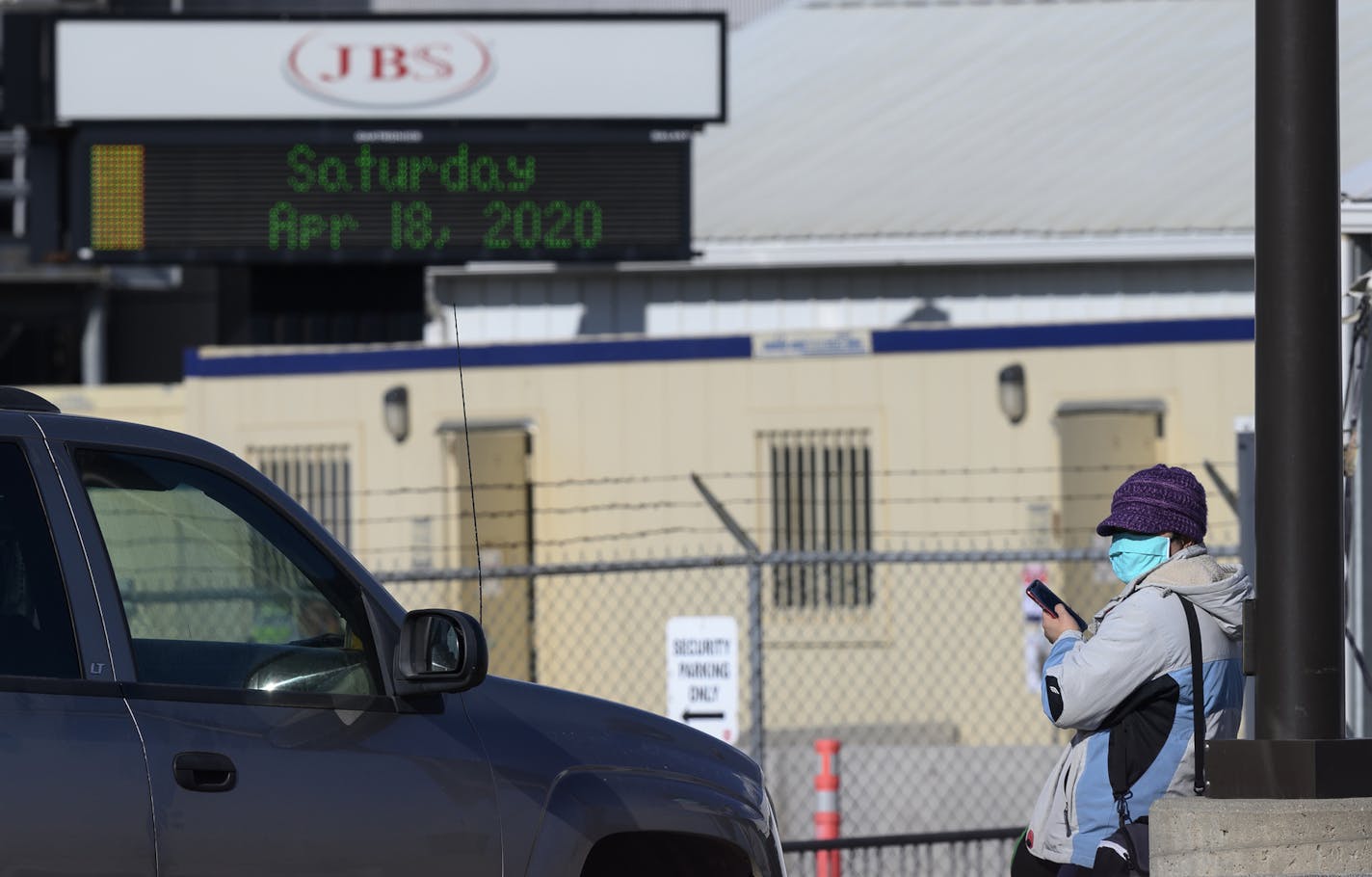 Workers depart the JBS Worthington Pork Plant, donning face masks at the end of their shift Saturday afternoon, April 18, 2020. (Aaron Lavinsky/Minneapolis Star Tribune/TNS) ORG XMIT: 1641336