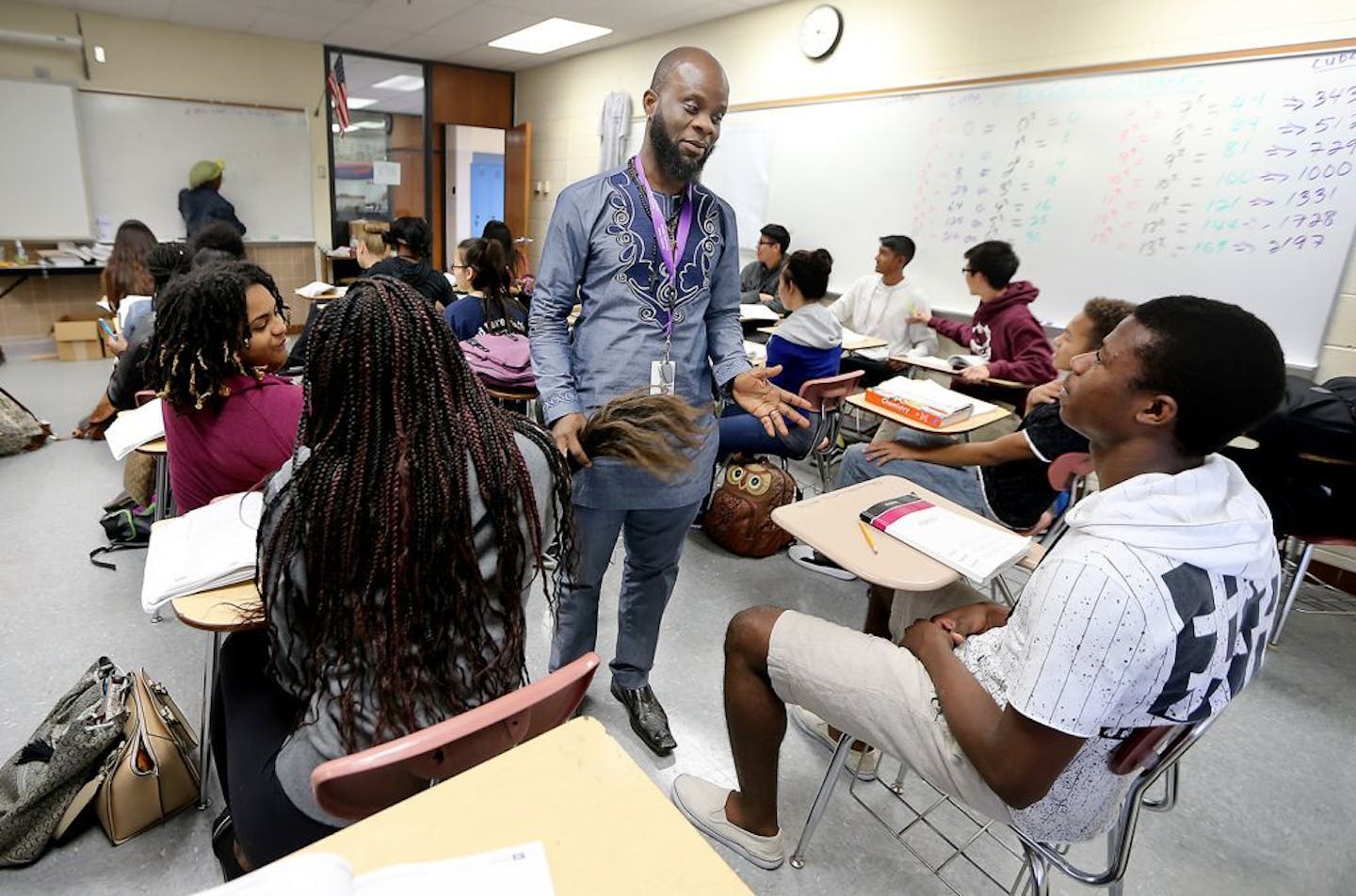 Sizi Goyah, Liberian High School teacher in Brooklyn Center, teaches a math class, Wednesday, October 12, 2016 in Brooklyn Center, MN. Goya has personally experienced racial microaggressions and helps his students understand the importance of valuing their cultures and their names. He wears his traditional African clothes to show his students the importance of valuing their cultures.