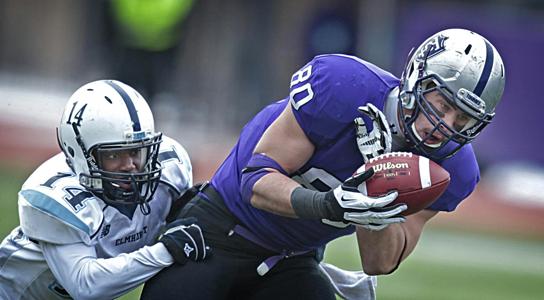 UST's Logan Marks hauled in a first down pass late in the 2'nd quarter against Elmurst's Marvin Carr.