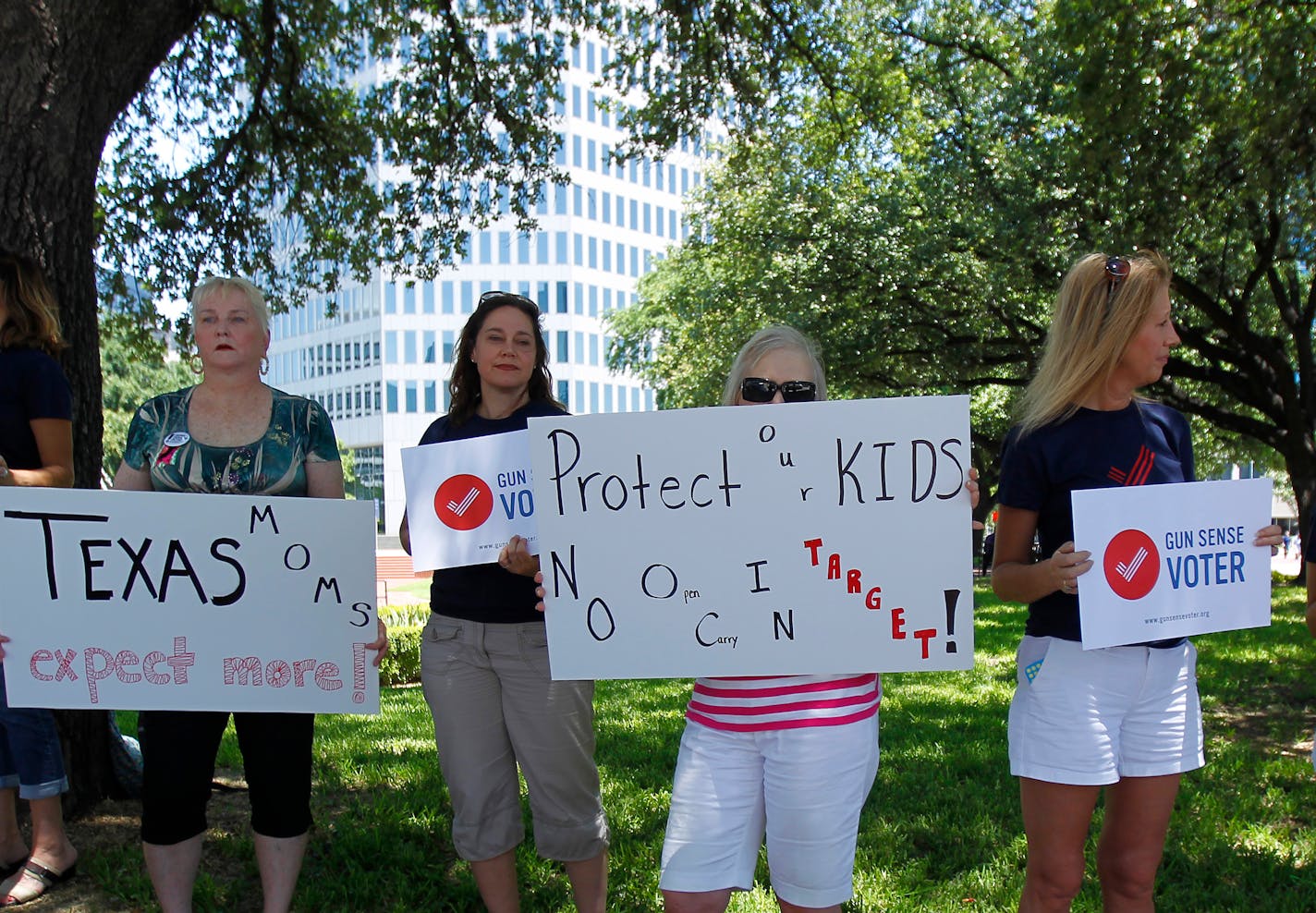 A protest against guns in Target stores was held Wednesday, June 11, 2014, in Ferris Plaza under the shade trees across the street from Union Station. The women said they were protesting to call attention to the issue while Target Corporation's annual shareholder meeting was being held across the street in Dallas.