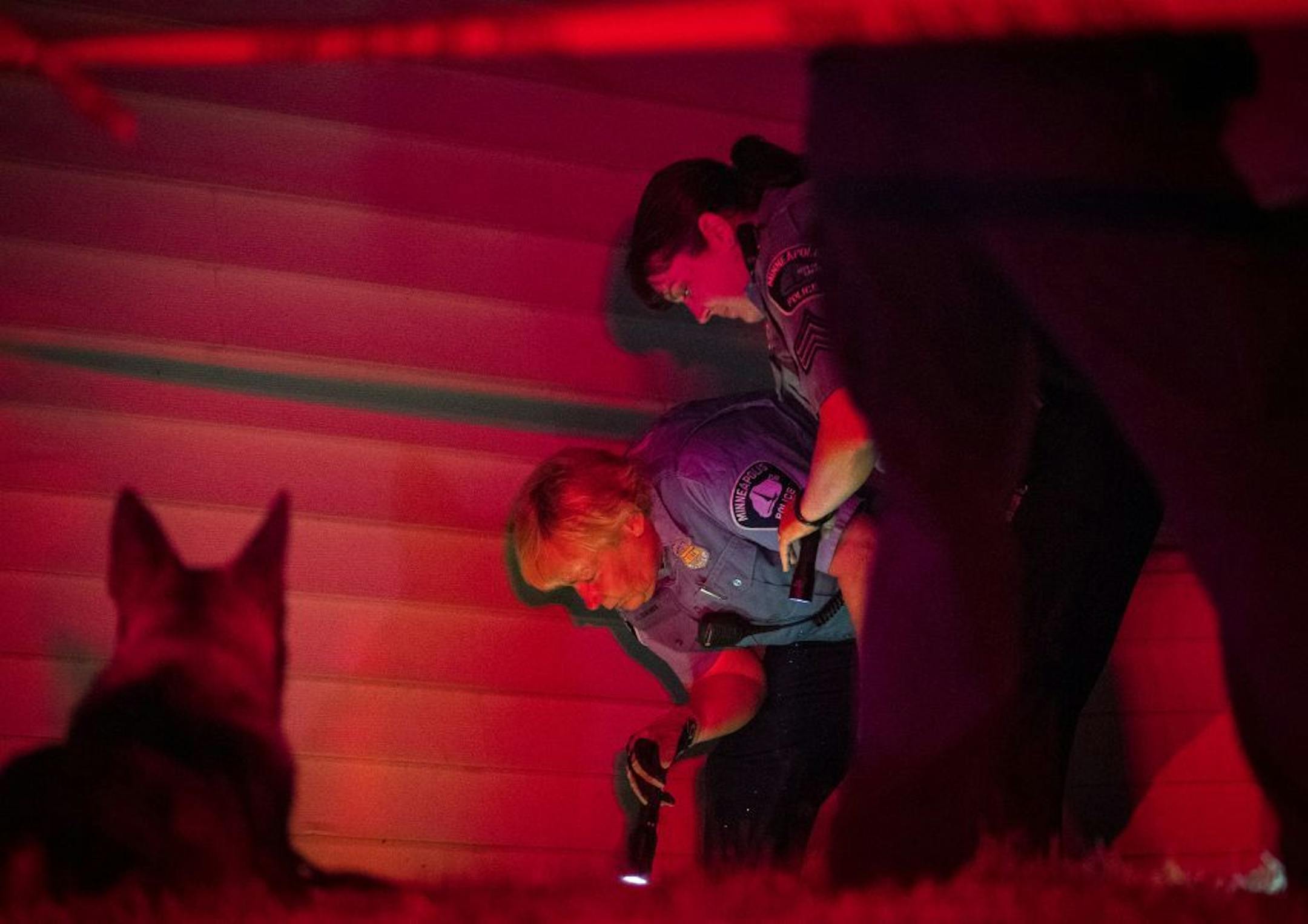 Minneapolis police looked for evidence next to a home near the scene of a fatal shooting at 21st and Penn avenue N. on Thursday night.