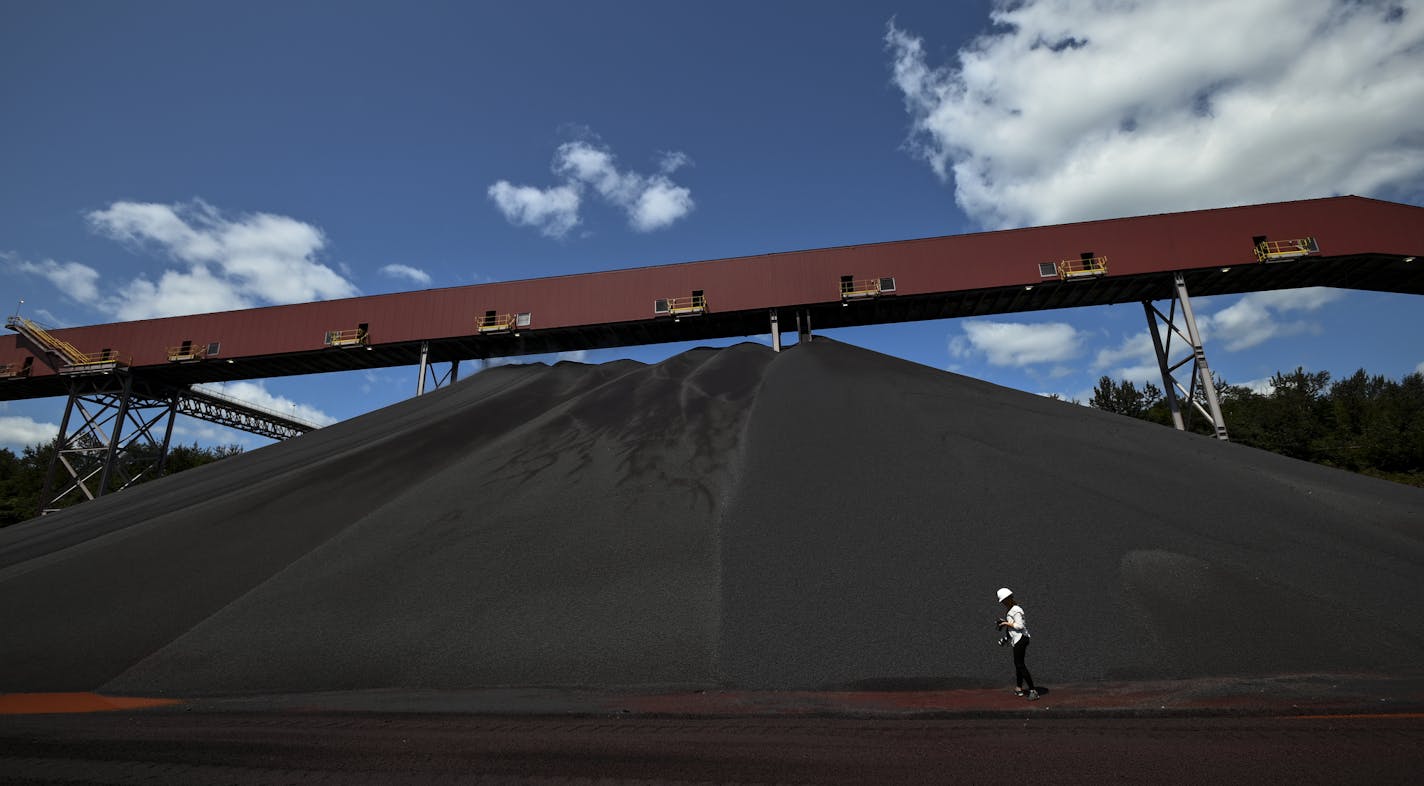 Media members photographed a pile of Cleveland-Cliffs' new DR-grade pellets Tuesday afternoon. ] Aaron Lavinsky &#xa5; aaron.lavinsky@startribune.com Cleveland-Cliffs held a press conference and ribbon cutting ceremony to celebrate the completion of the company's DR-Grade Pellet Project at Northshore Mining in Silver Bay, Minn on Tuesday, Aug. 6, 2019. Following the ribbon cutting, members of the media were given a tour of parts of the facility.