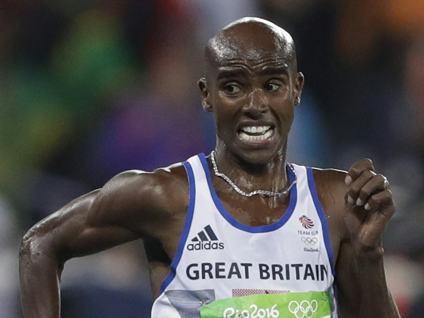 Britain's Mo Farah, right, and Kenya's Paul Kipngetich Tanui compete in the men's 10,000-meter final during the athletics competitions of the 2016 Summer Olympics at the Olympic stadium in Rio de Janeiro, Brazil, Saturday, Aug. 13, 2016. (AP Photo/Kirsty Wigglesworth)