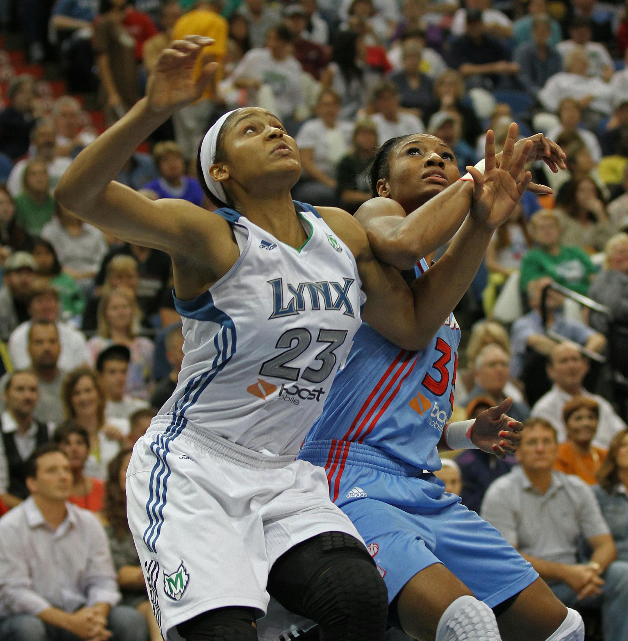 Maya Moore (23) battles Atlanta's Angel McCoughtry for a rebound in the first half. The Minnesota Lynx beat the Atlanta Dream 88-74 in the first game of the WNBA Finals. ] SHARI L. GROSS * sgross@startribune.com, October 2, 2011, Minneapolis, Minn, Target Center ORG XMIT: MIN2013070816162278
