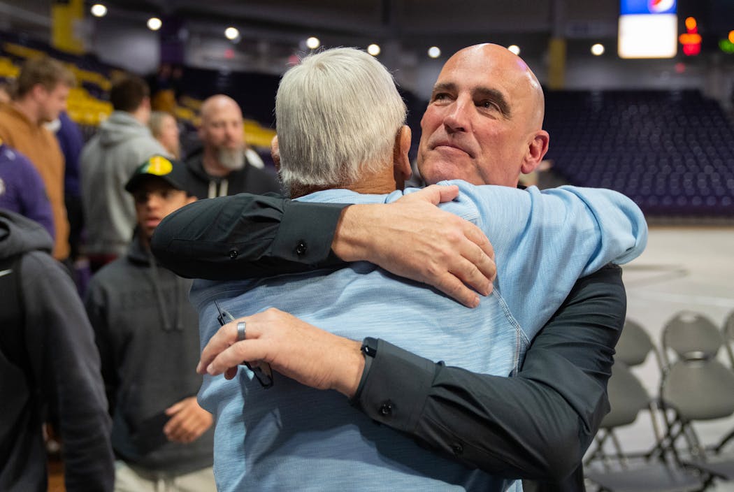 Minnesota State coach Matt Margenthaler embraces his father, Jack, after a celebration in April in Mankato.