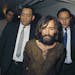 FILE - In this 1969 file photo, Charles Manson is escorted to his arraignment on conspiracy-murder charges in connection with the Sharon Tate murder c
