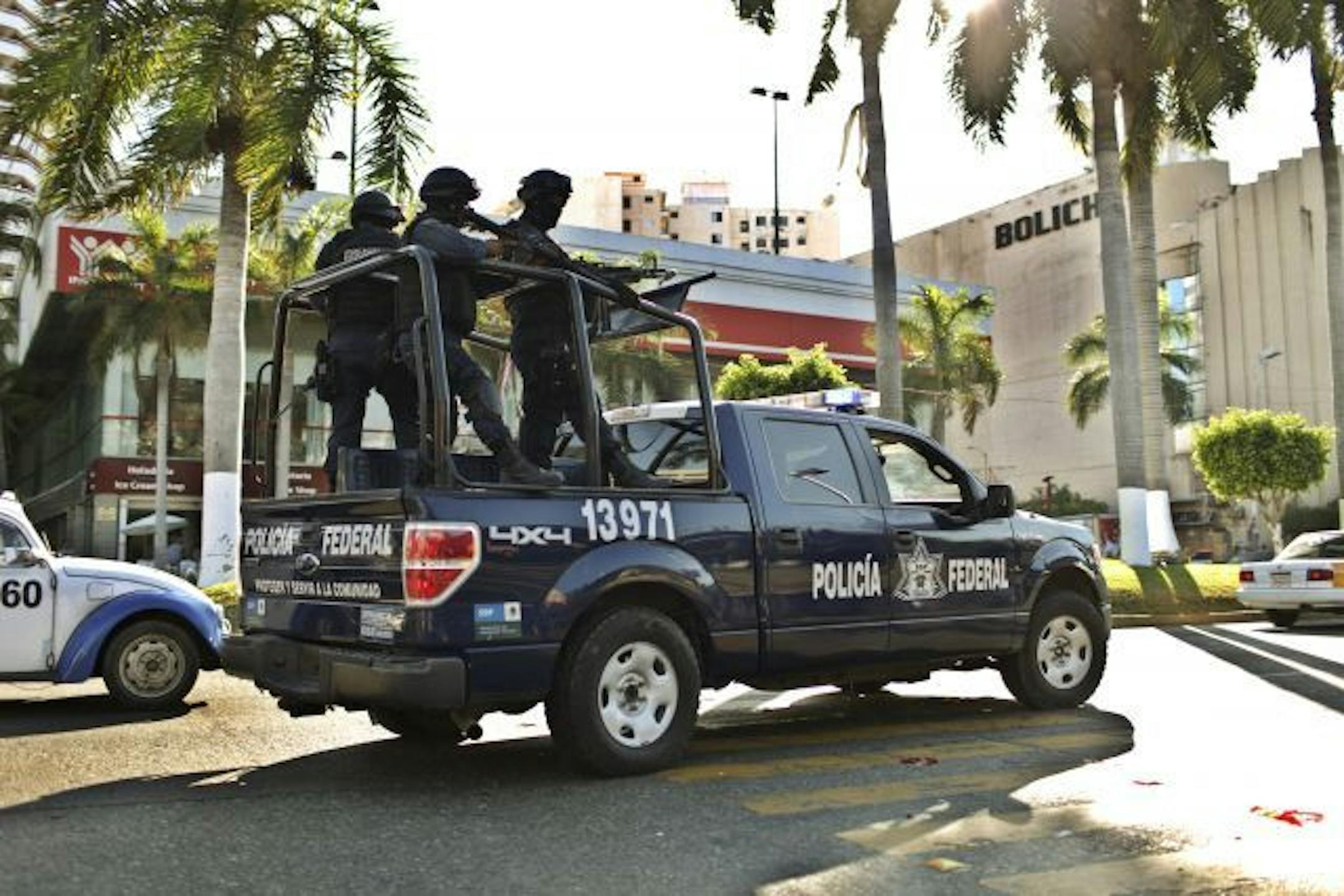Mexican federal police officers patrols the streets of Acapulco, Mexico, Jan. 28, 2011. Mexican and American officials, crediting American training of the military and what they consider to be an increasingly professional federal police force, says that it has captured more than half of last year�s most wanted crime bosses, but a poll by Mexico�s national statistics institute shows an increase in those concerned for their safety.
