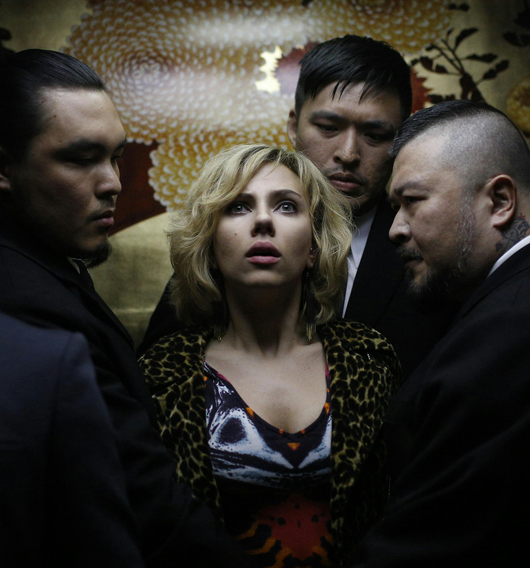 Lucy (SCARLETT JOHANSSON) is temporarily held hostage by thugs in "Lucy", an action-thriller that examines the possibility of what one human could truly do if she unlocked 100 percent of her brain capacity and accessed the furthest reaches of her mind.