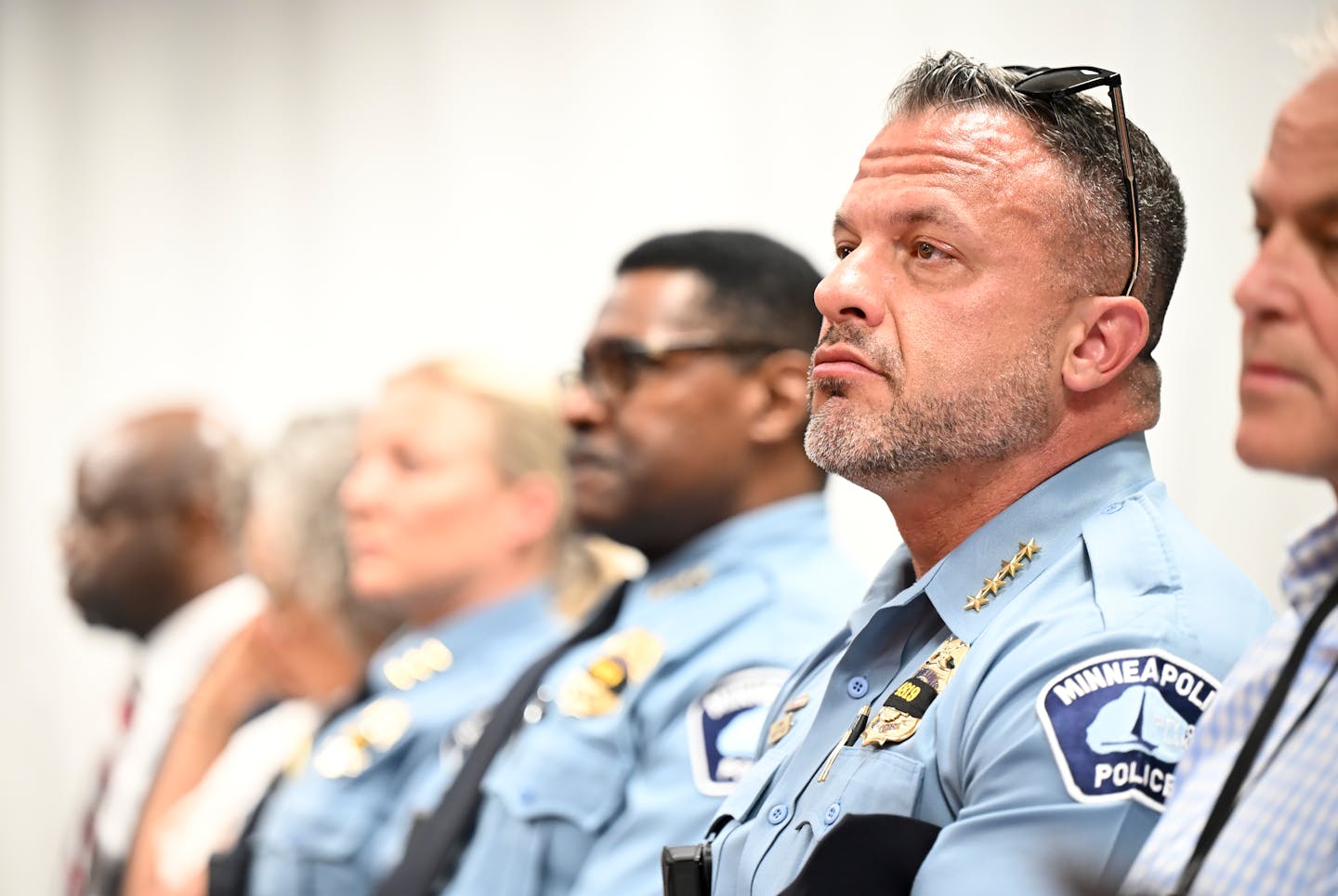 Minneapolis Police Chief Brian O’Hara sits beside his senior command staff during a city council committee hearing June 25 at the Minneapolis Public