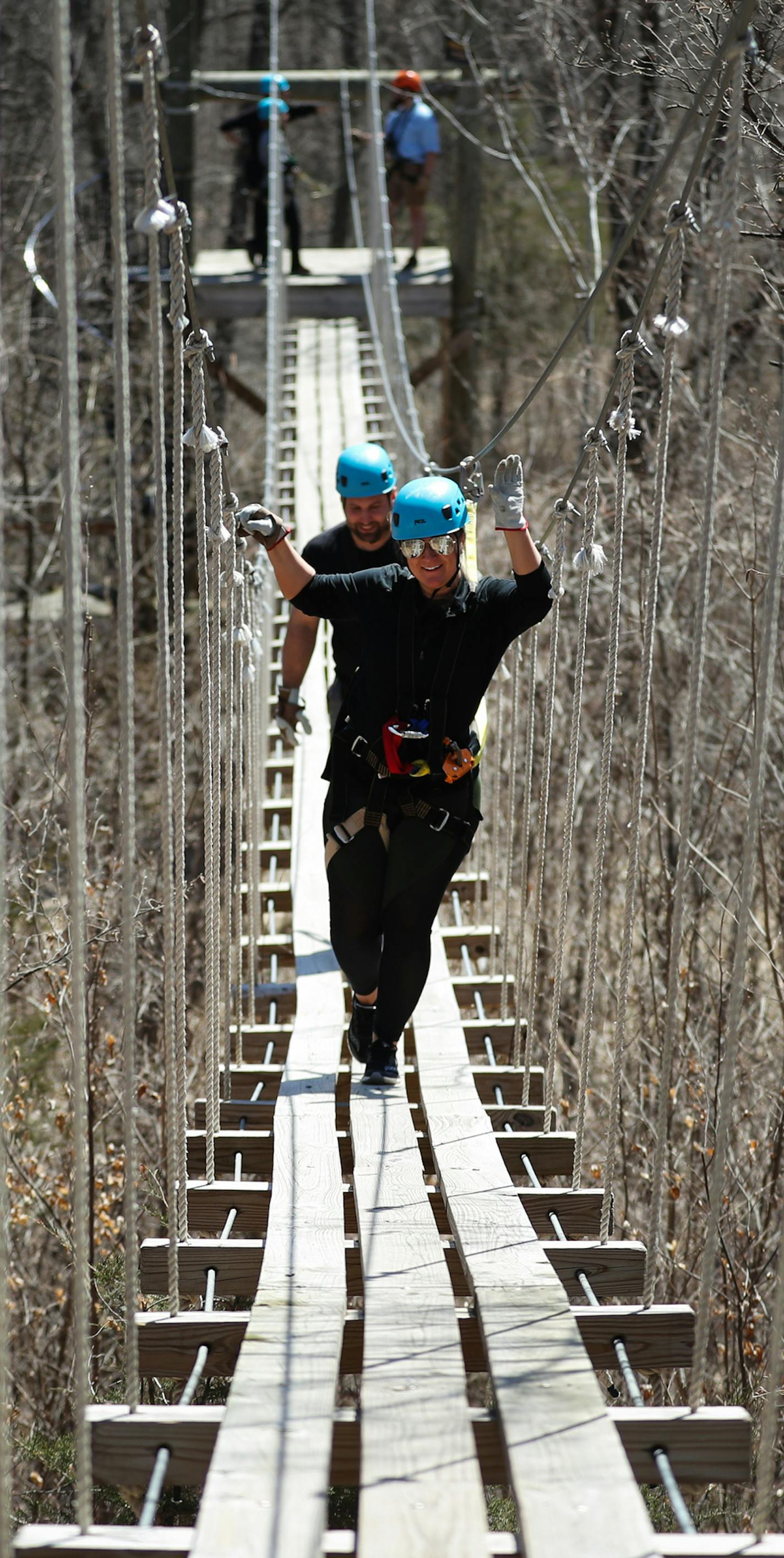 Zipline season is underway at Kerfoot Canopy Tours along the Minnesota River about an hour south of Minneapolis. In this photo, Tabetha Dettlaff and Zach Rydbom walk across the 170-foot suspension bridge. ] Shari L. Gross &#xa5; shari.gross@startribune.com Zipline season is underway at Kerfoot Canopy Tours along the Minnesota River about an hour south of Minneapolis. Sunday tab cover potential and inside display. Kerfoot Canopy Tour contains a whopping 14 zip lines spanning one mile of Minnesota