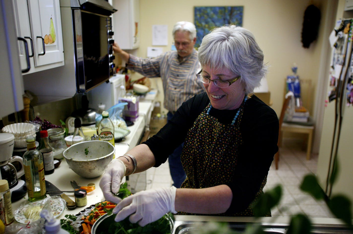 Cindy Pawlcyn, with help from her brother Steve Pawlcyn, put the finishing touches on a variety of finger foods to be served at a pre-wedding party for Cindy Pawlcyn and her fiance John Watanabe.