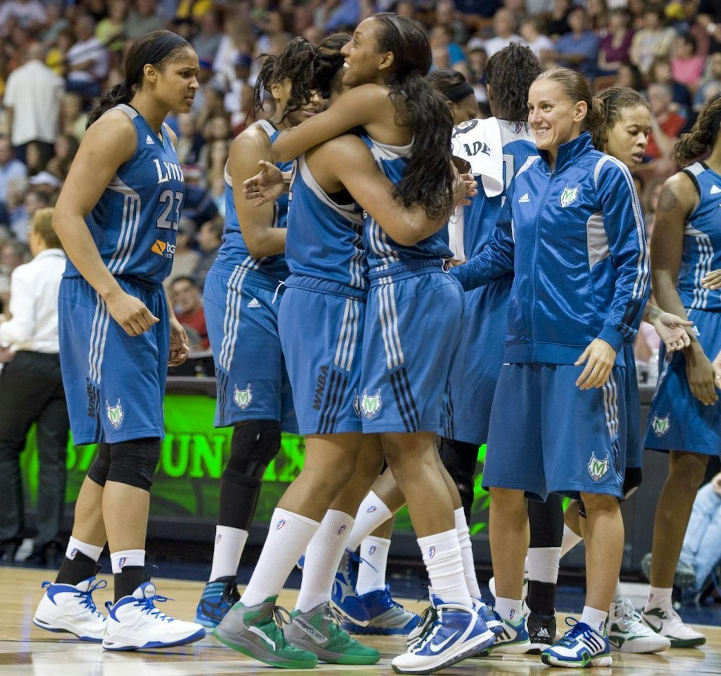 Minnesota Lynx players celebrate in the final minutes of play in a WNBA basketball game against the Connecticut Sun in Uncasville, Conn., Friday, June 1, 2012. Minnesota won 85-72.