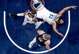 The Timberwolves' Karl Anthony Towns (32) reacts after a jump ball call in Game 4 of the NBA Western Conference semifinals against the Denver Nuggets 