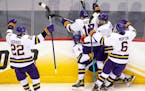 Minnesota State Mankato players celebrated after defenseman Andy Carroll (4) scored a goal to bring the Mavericks to within one in the second period. 