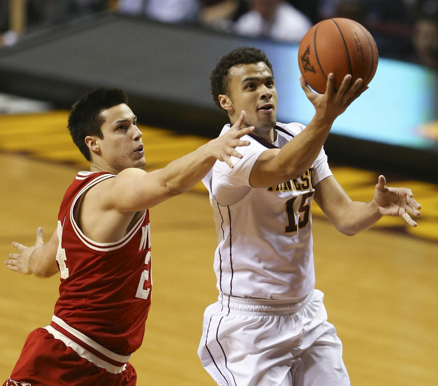 Gophers guard Stephon Sharp (15) put up a shot ahead of Badgers guard Bronson Koenig (24) in the first half Wednesday night. ] JEFF WHEELER &#xef; jeff.wheeler@startribune.com The University of Minnesota men's basketball team faced Wisconsin Wednesday night, March 2, 2016 at Williams Arena in Minneapolis.