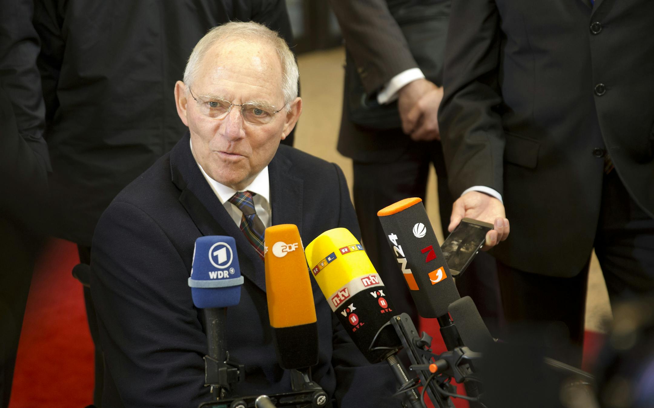 German Finance Minister Wolfgang Schaeuble speaks with the media as he arrives for a meeting of eurogroup finance ministers in Brussels on Friday, Feb. 20, 2015. Eurozone finance ministers meet for a crucial day of talks Friday to see whether a Greek debt relief proposal is acceptable to Germany and other nations using the common currency. (AP Photo)