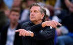 Minnesota Timberwolves coach Chris Finch signals to players during the second half of the team's NBA basketball game against the San Antonio Spurs, We