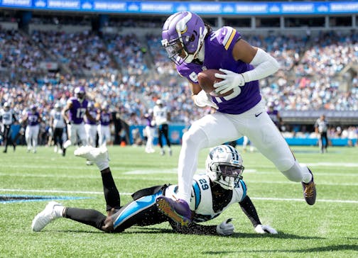 Minnesota Vikings Justin Jefferson (18) catches a 30-yard touchdown pass in the third quarter Sunday, Oct. 1, 2023, at Bank of America Stadium in Charlotte, NC.