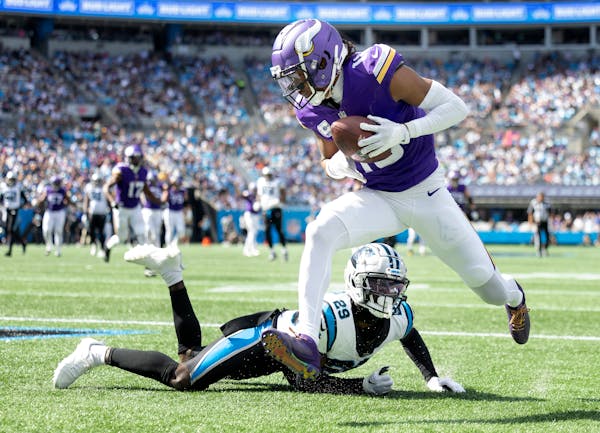 Minnesota Vikings Justin Jefferson (18) catches a 30-yard touchdown pass in the third quarter Sunday, Oct. 1, 2023, at Bank of America Stadium in Char