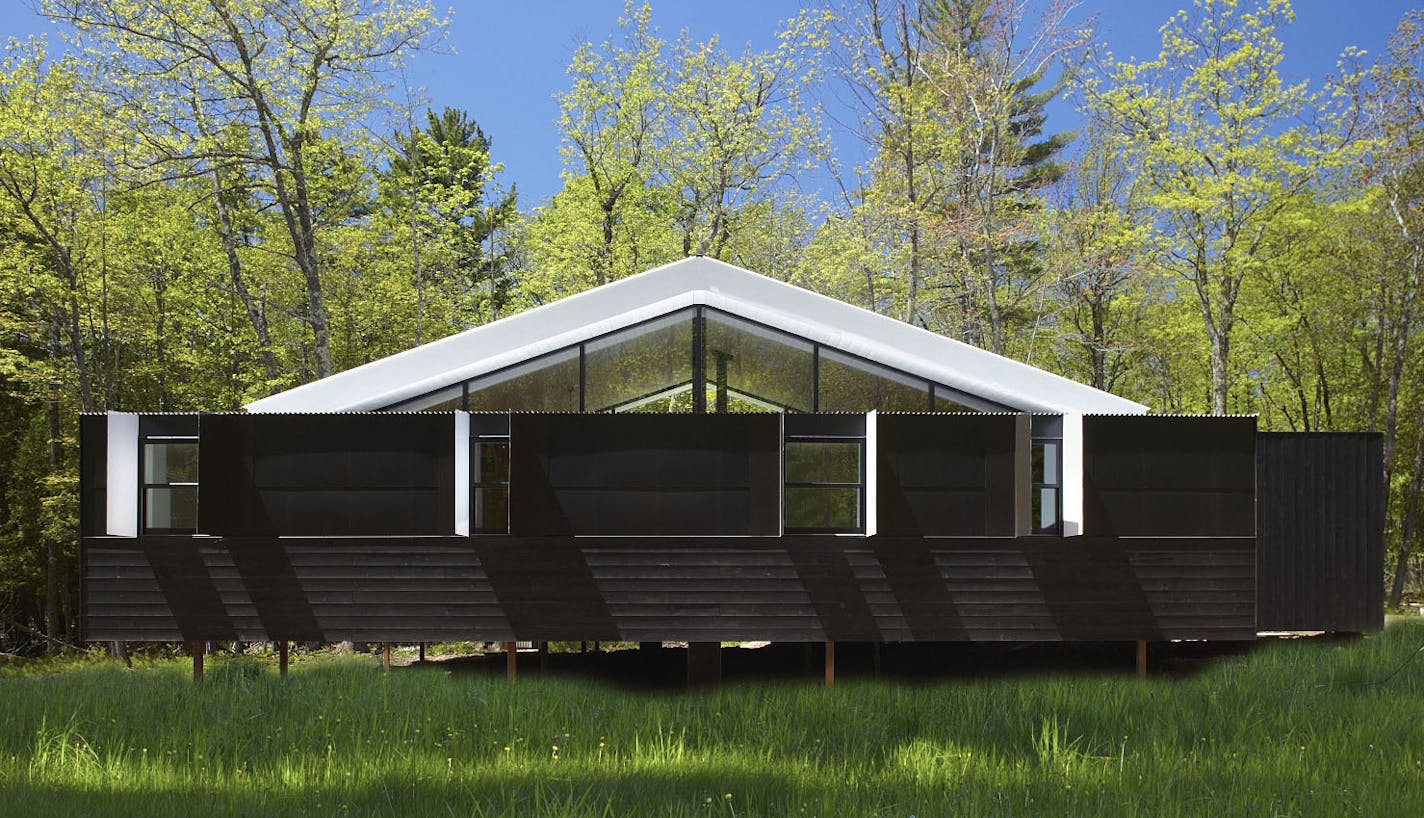 Charlie Lazor&#x2019;s &#x201c;Week&#x2019;nder&#x201d; cabin is a geometrical trickster: Its front profile, with a central open space framed by prefab components, suggests nothing of its dramatic side profile.