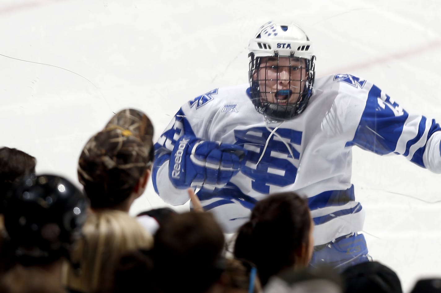 Matt Perry (23) of St. Thomas Academy celebrated after scoring in the third period. It was Perry's third goal of the game. St. Thomas Academy beat Hermantown by a final score 5-4.